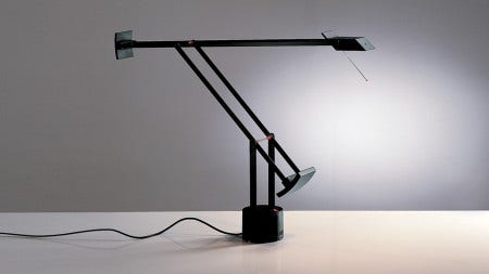 The Artemide Tizio Classic Table Lamp is available with a halogen or LED bulb and comes in 3 finishes, black, white or silver grey. The Artemide Tizio family includes The Classic, Tizio Plus, Tizio X30, Tizio 35, Tizio Micro, Tizio LED and the Tizio Floor Lamp.